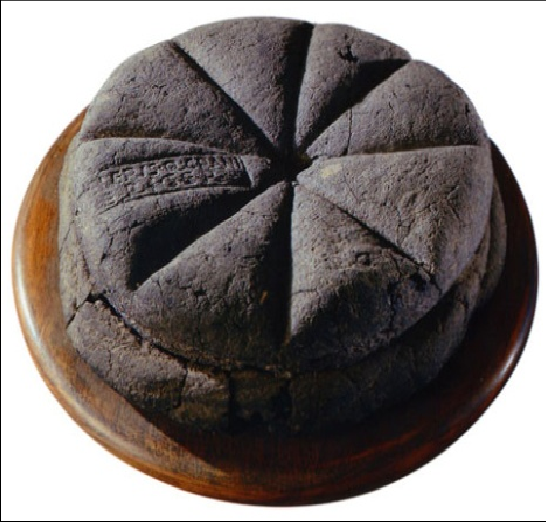 A stamped loaf of bread from Pompeii dated to the first century